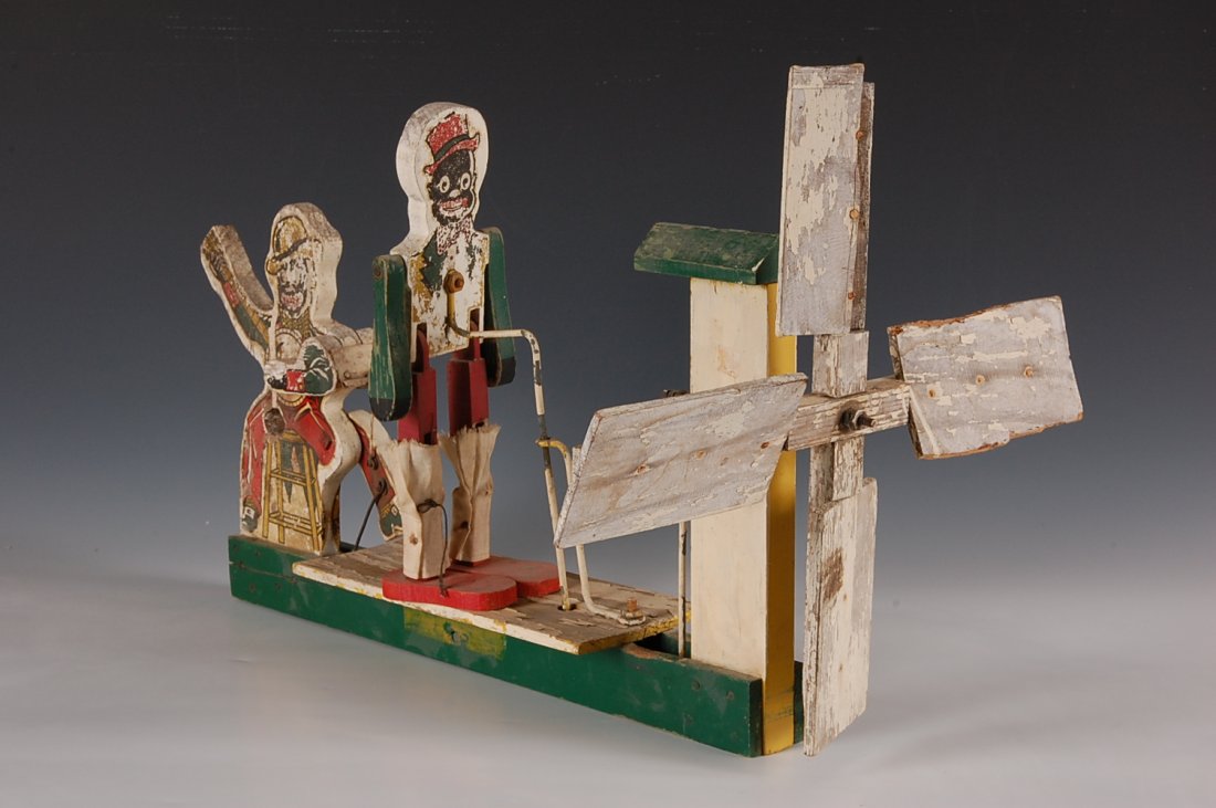 FOLK ART WHIRLIGIG WITH MINSTRELS: Measures 21 x 12.5 inches.