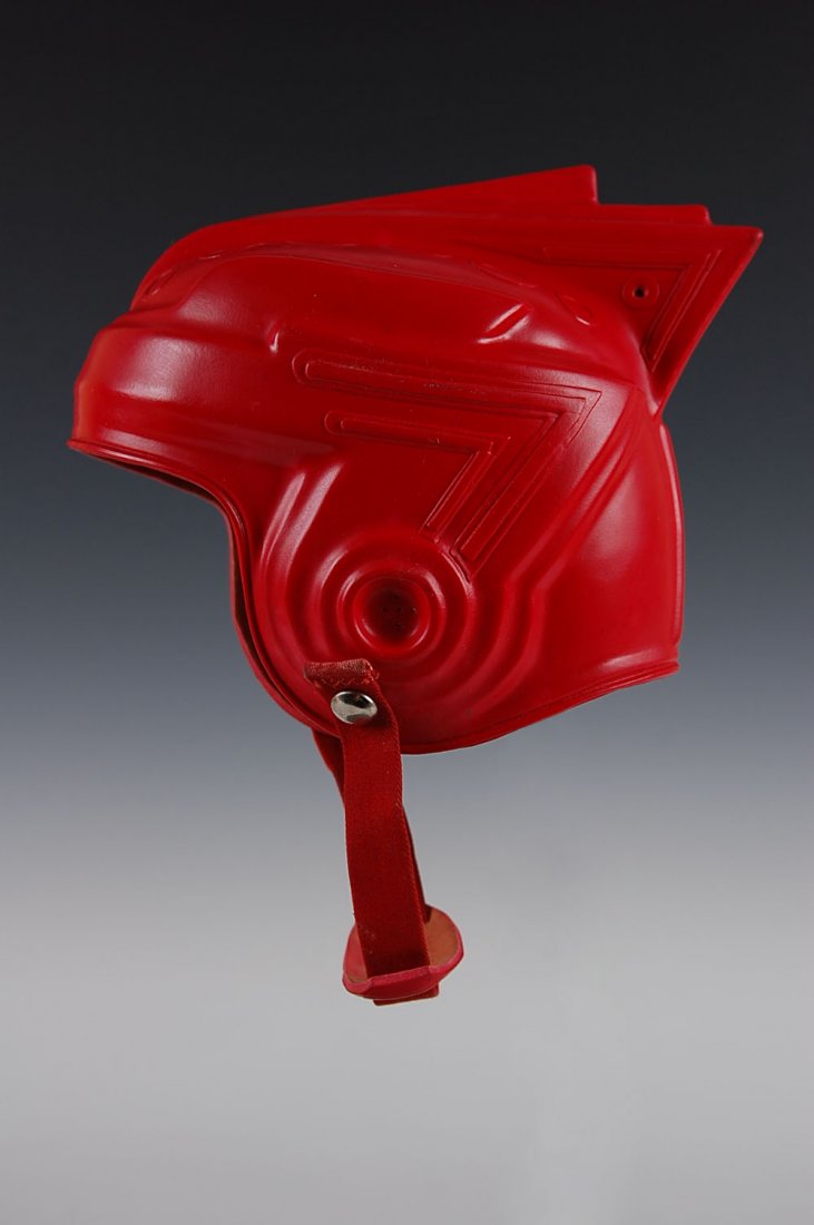 BUCK ROGERS SPACE HELMET CIRCA 1950s: A nice clean rubber helmet marked S at the back for size small, original chinstrap and clean condition. Measures 7 x 8 inches, not including the chin strap.