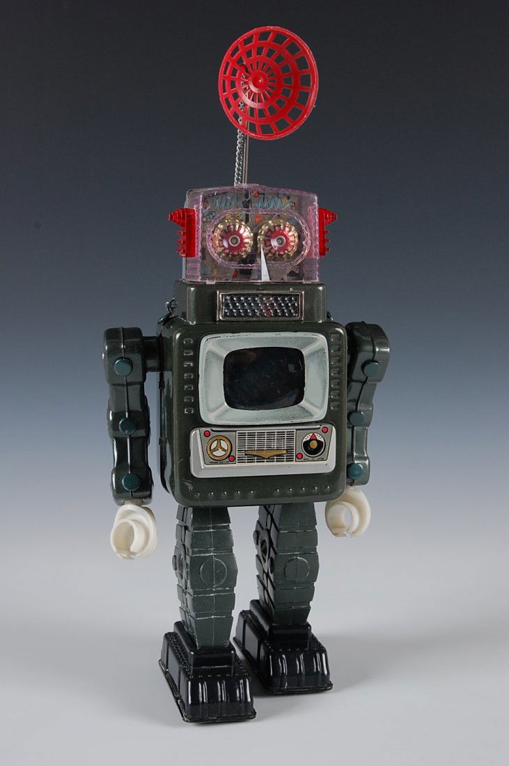 TELEVISION SPACEMAN BATTERY OPERATED ROBOT: Tin and plastic robot with the plastic battery compartment door. Measures 14.5 inches.
