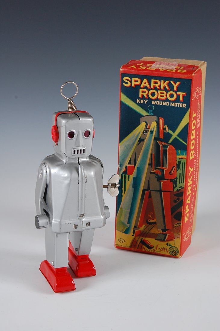 SPARKY ROBOT TIN WIND-UP TOY ROBOT, MIB: Robot measures 8 inches. Box measures 8 x 3.25 x 3 inches. Winds up and walks forward, no sparks seen. Visit our web site for a video of this robot operating.