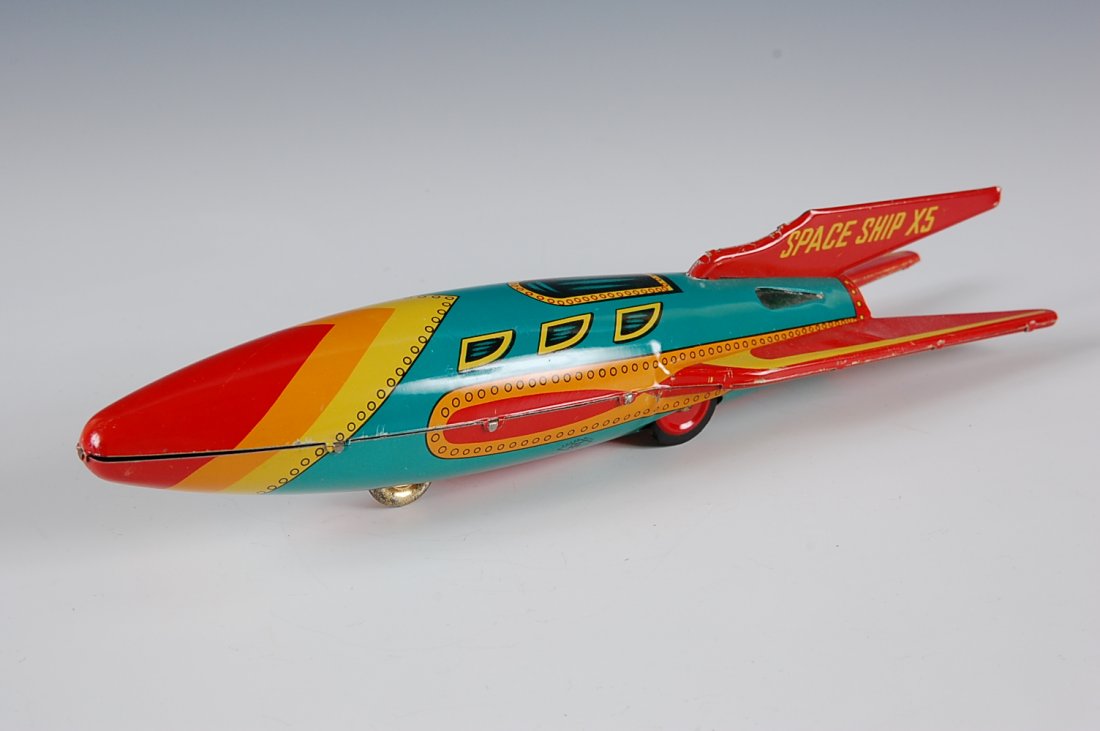 SPACE SHIP X-5 TIN FRICTION SPACE TOY CIRCA 1960S: Measures 12 inches long.