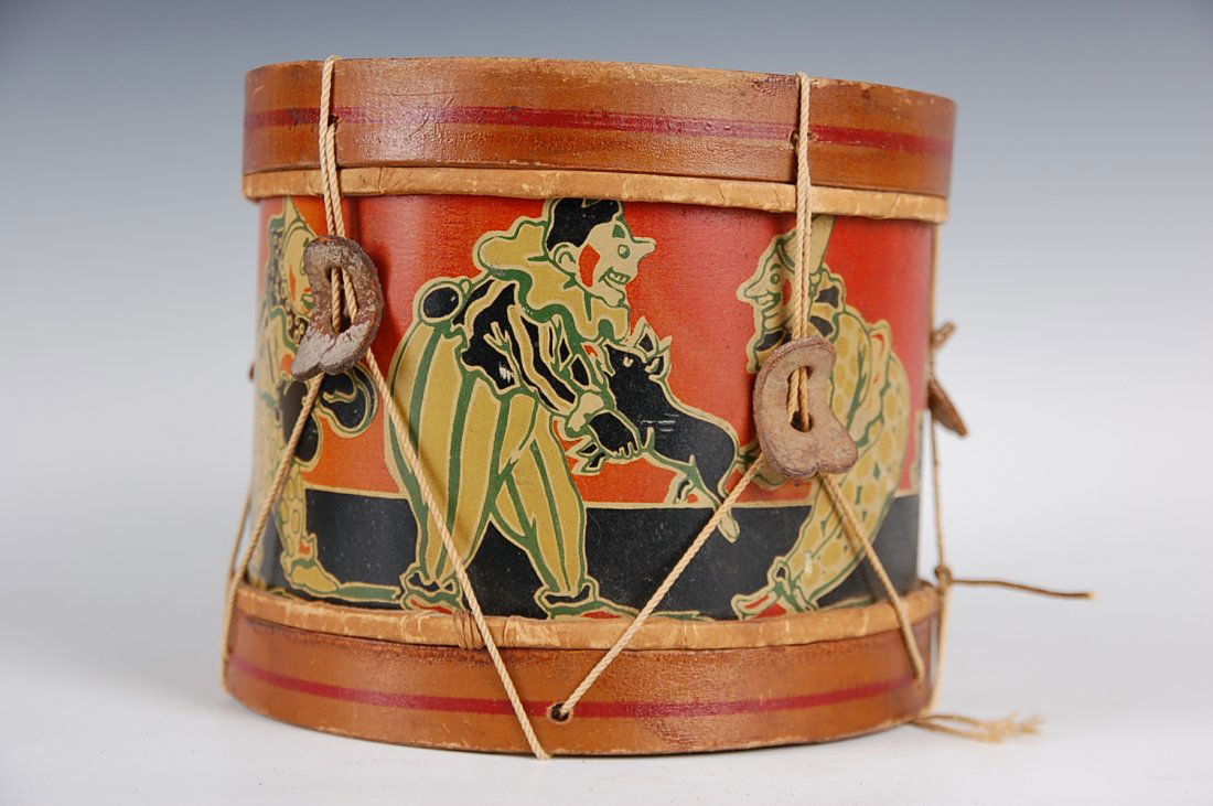 TIN LITHO TOY DRUM WITH WOOD RIM AND CLOWNS: Measures 6.5 x 7.75 inches.