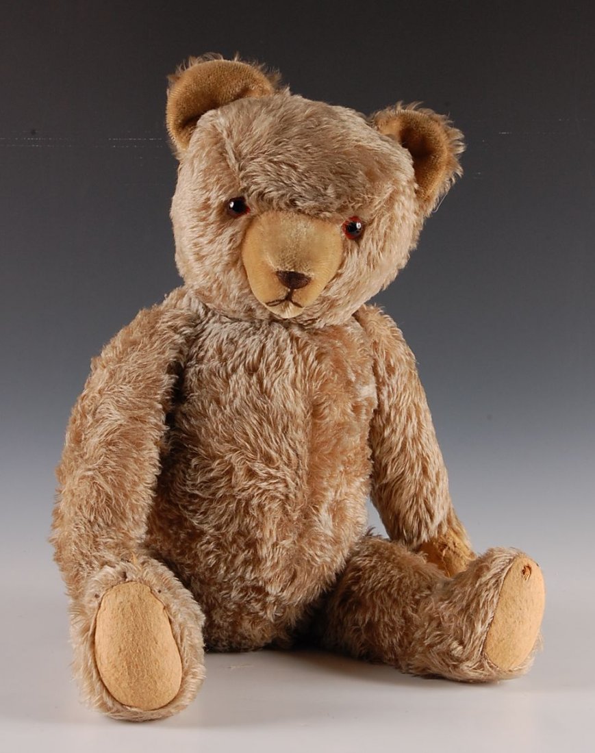 21 INCH MOHAIR EXCELSIOR FILLED BEAR WITH GROWLER: Nice bear with tipped mohair, excelsior filling, glass eyes, a working growler, and pronounced nose with a short lighter colored tan mohair that matches the inside of his ears. Measures 21 inches.