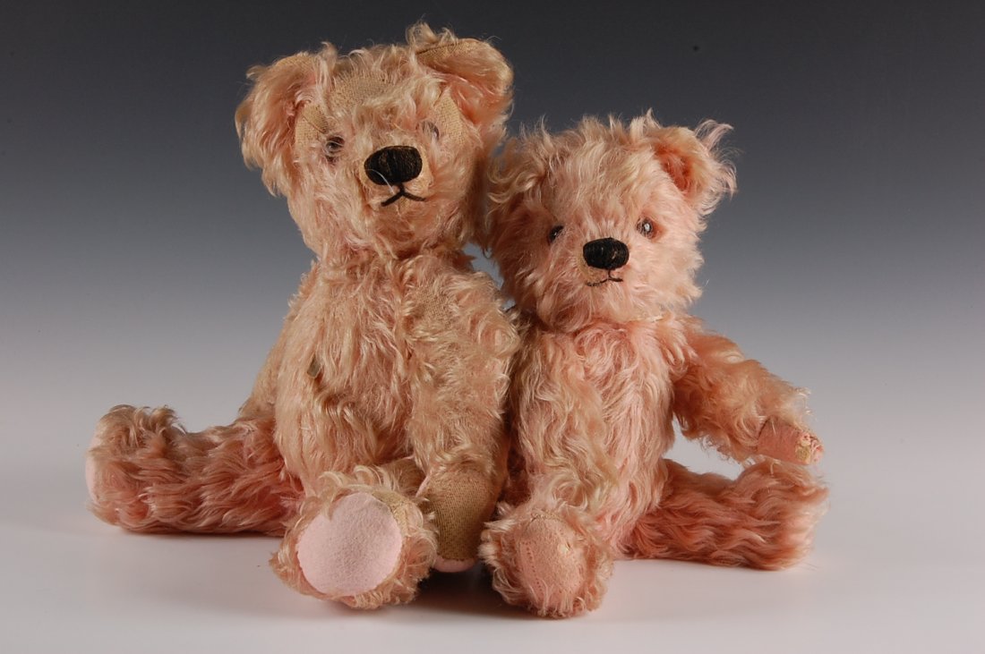 TWO PINK PLUSH MOHAIR TEDDY BEARS: Two pink bears, measure 14 and 15 inches.