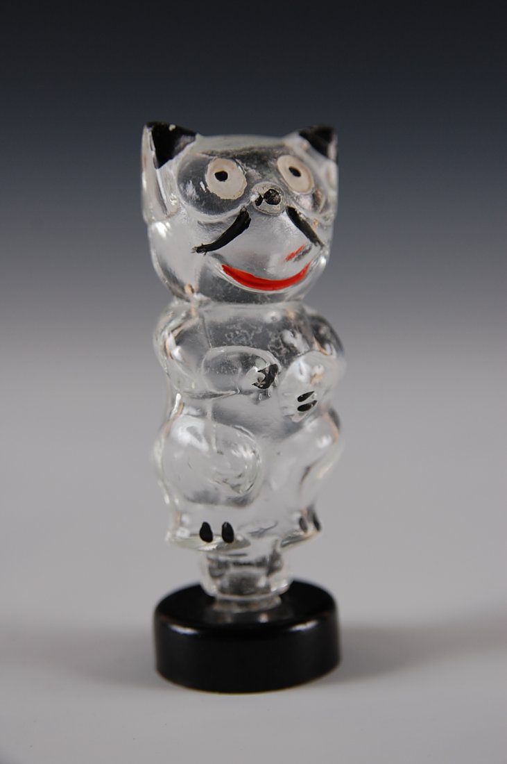 FELIX THE CAT PURFUME BOTTLE, GERMANY: Measures 3 inches high, original paint detail and embossed Germany in the glass