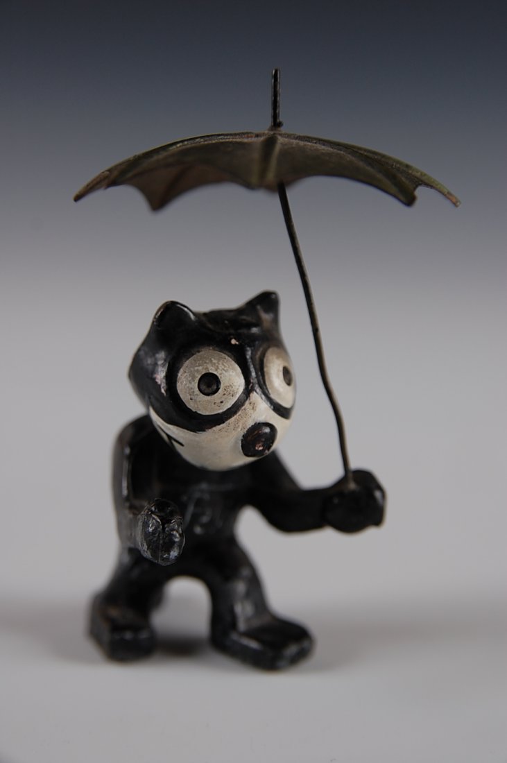 DIE CAST FELIX THE CAT NODDER WITH UMBRELLA: Measures 3 inches.