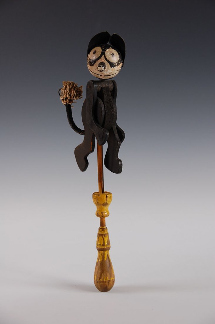 EARLY WOOD FELIX WALKING TOY, COPYRIGHT 1919: Reciprocating action, original paper label, the ears are probably replacement and there may be some black paint touch up. Measures 11 inches overall