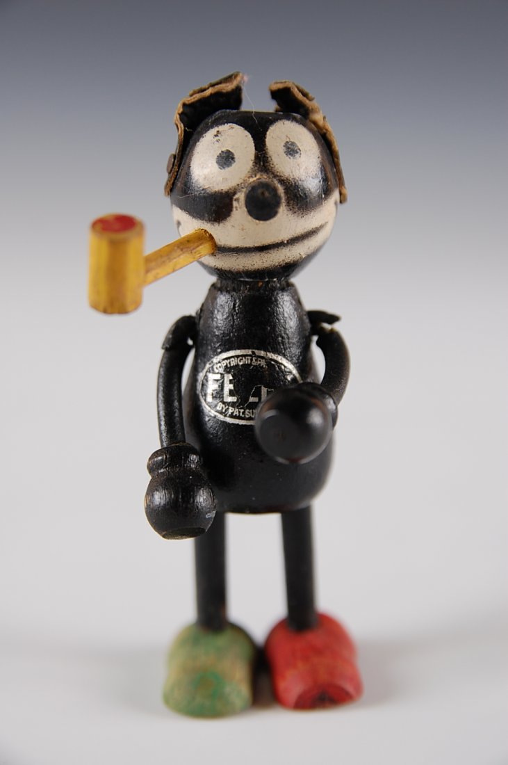 FELIX THE CAT WOOD JOINTED FIGURE SMOKING PIPE: Circa 1920s jointed flex figure with original decal, measures 3 1/4 inches
