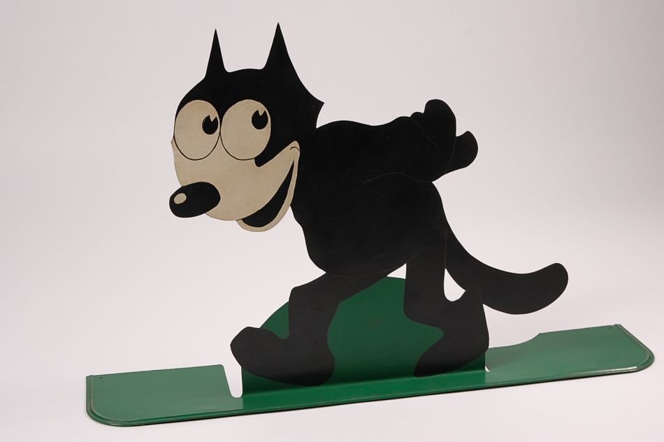 LARGE SILHOUETTE FELIX THE CAT TIN FOLK ART FIGURE: A one piece tin figure cut from one sheet including the base with crimped edge and mounting holes on the backside. The figure measures 24 x 27 inches. Unknown origin and use.