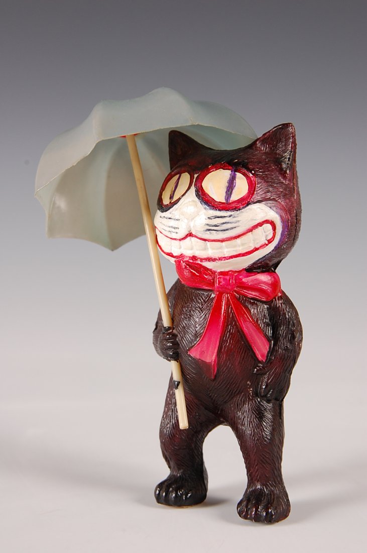 FELIX THE CAT CELLULOID FIGURE WITH UMBRELLA: Mark Japan with patent number 32030, perhaps some repaints to the eyes. Measures 4.5 x 1.25 inches.
