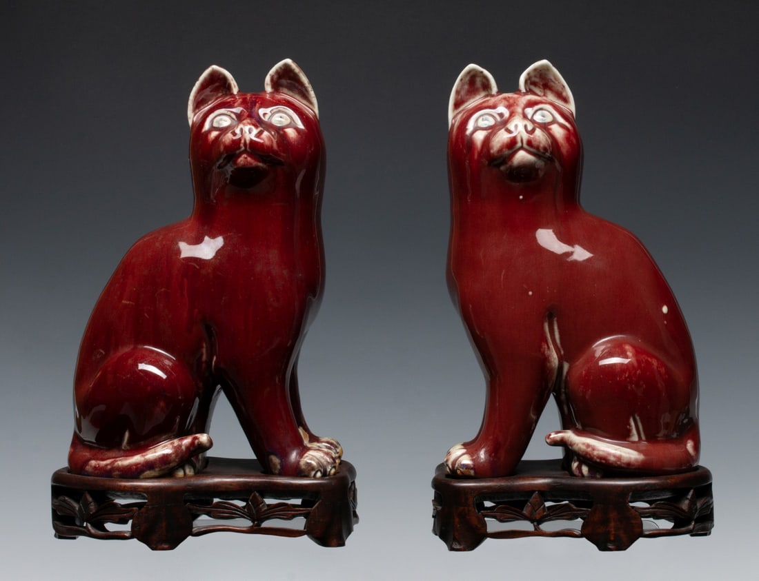 A PAIR OF CHINESE SANG-DE-BOUEF GLAZE PORCELAIN CATS (1 of 16)