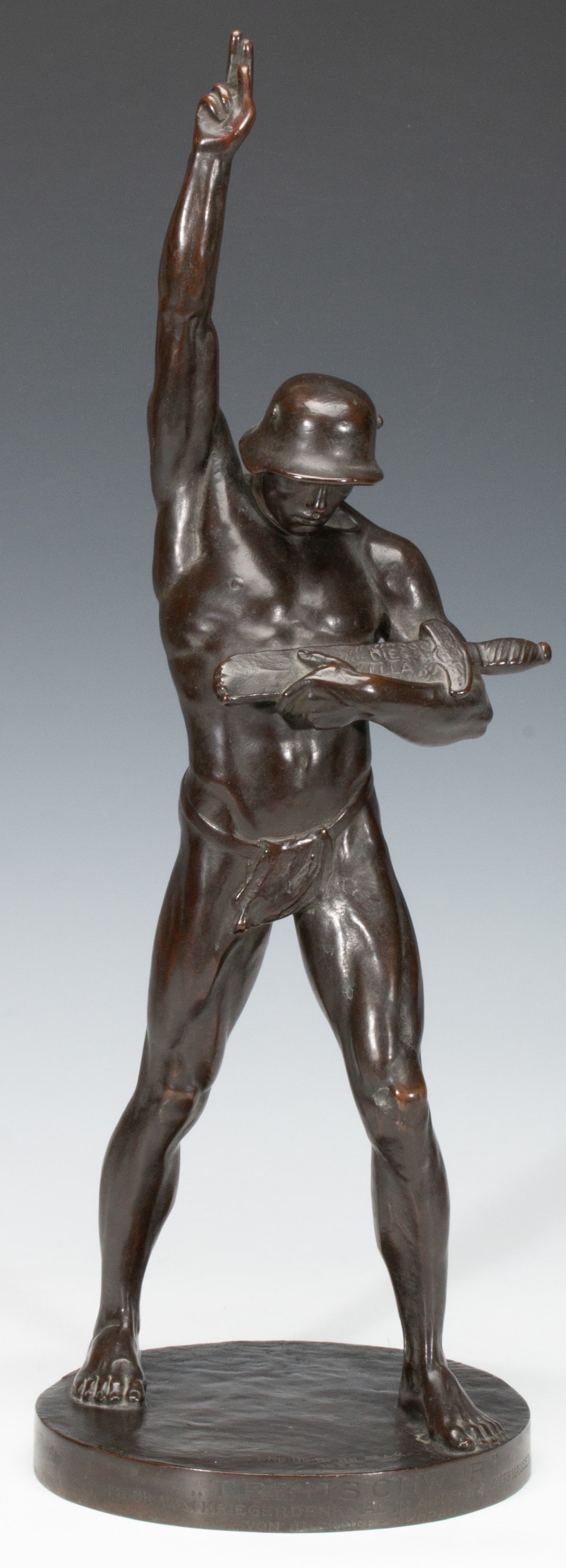 PAUL JUCKOFF-SKOPAU (1874-1936) GERMAN MILITARY TRIBUTE: Paul Juckoff-Skopau (1874-1936) Treuschwur (Pledge of Allegiance) 1938 The patinated metal figure of a German soldier giving the traditional two-fingered gesture (a salute that dates to ancient Greece