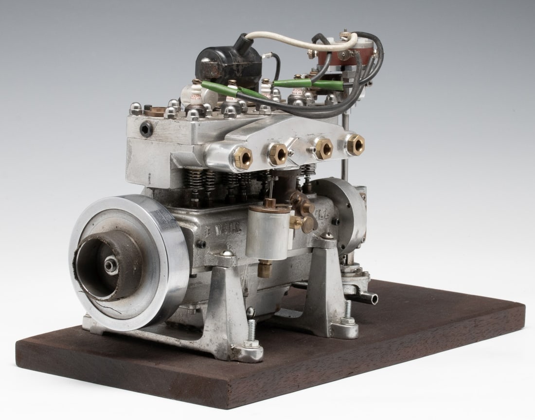 A FOUR CYLINDER MODEL GAS ENGINE BY ELMER WALL CHICAGO: Elmer Wall model gas powered engines became popular on a large scale beginning in the 1930s, though he began designing and crafting miniature gas engines for his son as early as 1904. Wall's engines w