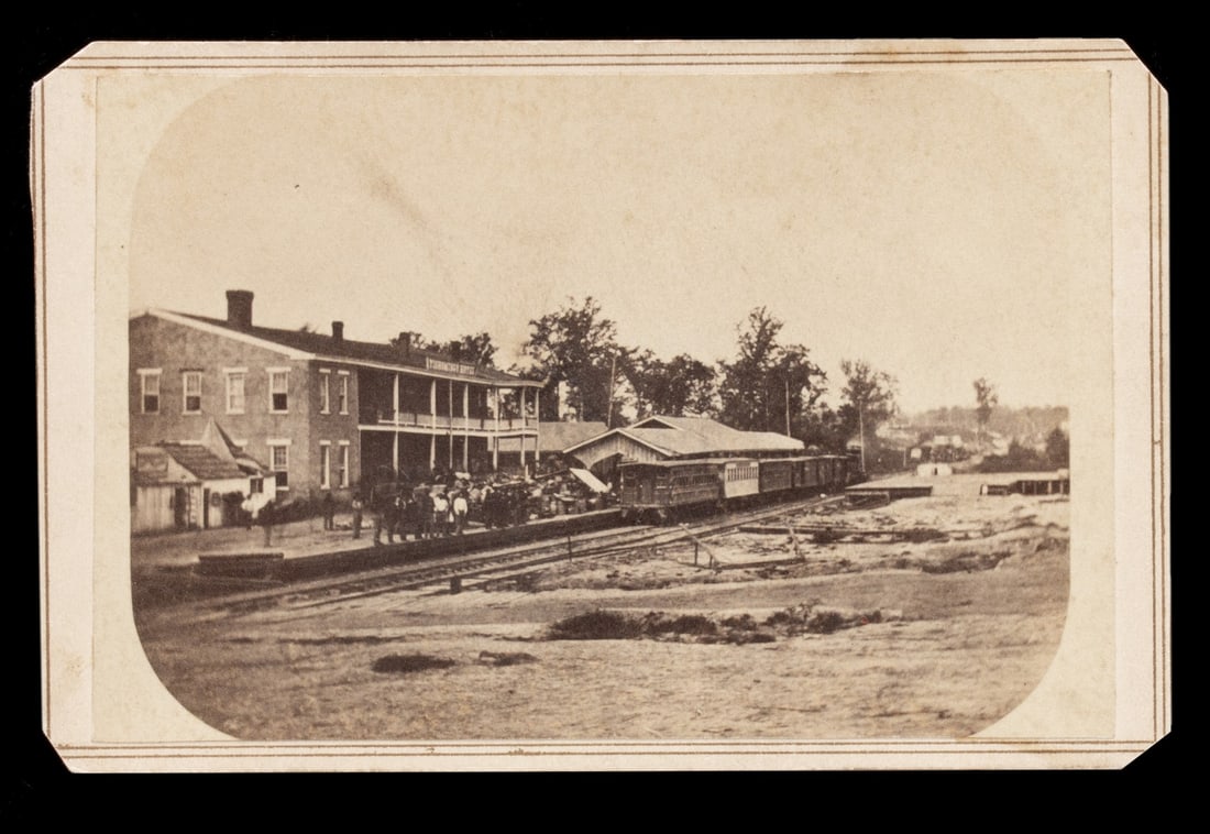 IMPORTANT CORINTH/CAMP DAVIES MISS CIVIL WAR CDV PHOTOS: 1. A very rare view of the Tishomingo Hotel in Corinth Mississippi, the Carte de Visite size mounted original photograph identified verso as Tishomingo House and depot of Mobile, Ohio & Memphis & Char