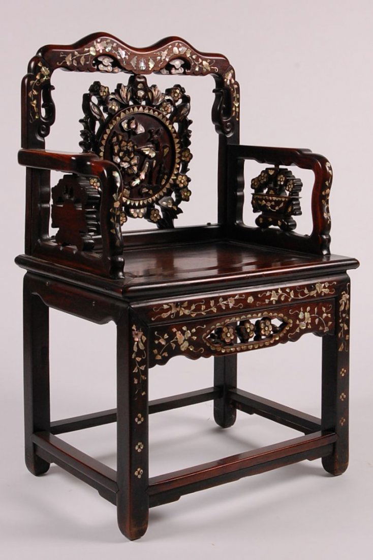 C. 1900 CHINESE ABALONE INLAID ROSEWOOD CHAIR: Heavily carved features including birds and florals. Measures 37.5 x 24 x 17.5 inches.
