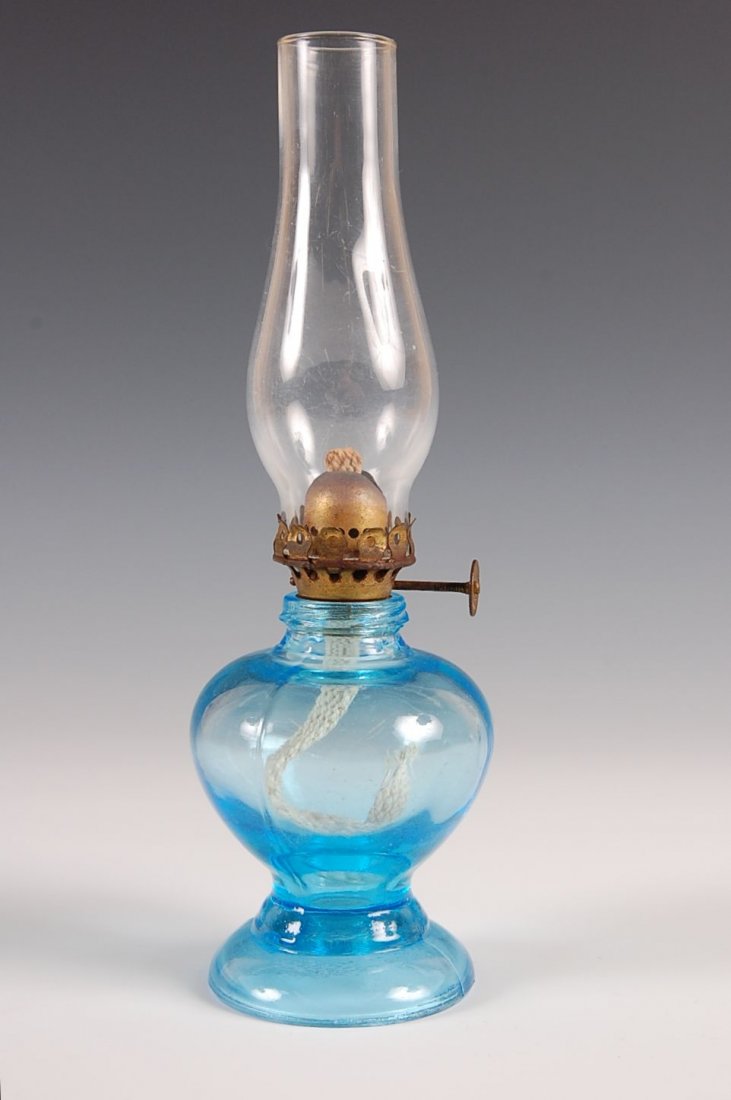 HANDY LAMP IN BLUE: Smith I Fig. 5. Marked 'Handy' on the base. Lamp measures 8.25" x 2.5".