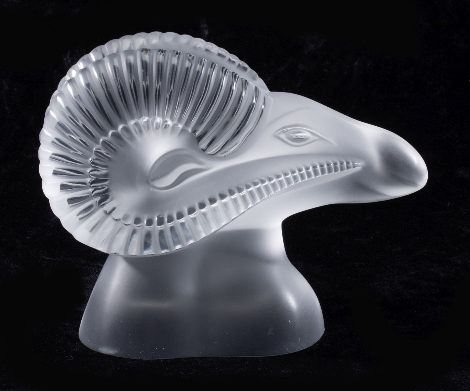 A LALIQUE FRENCH CRYSTAL STYLIZED RAM'S HEAD SCULPTURE: Late 20th Century The high quality frosted crystal figure of a ram is signed Lalique France in hand engraved script on the underside of the base. Measures 6.5 inches tall. Without proof of exemption, 