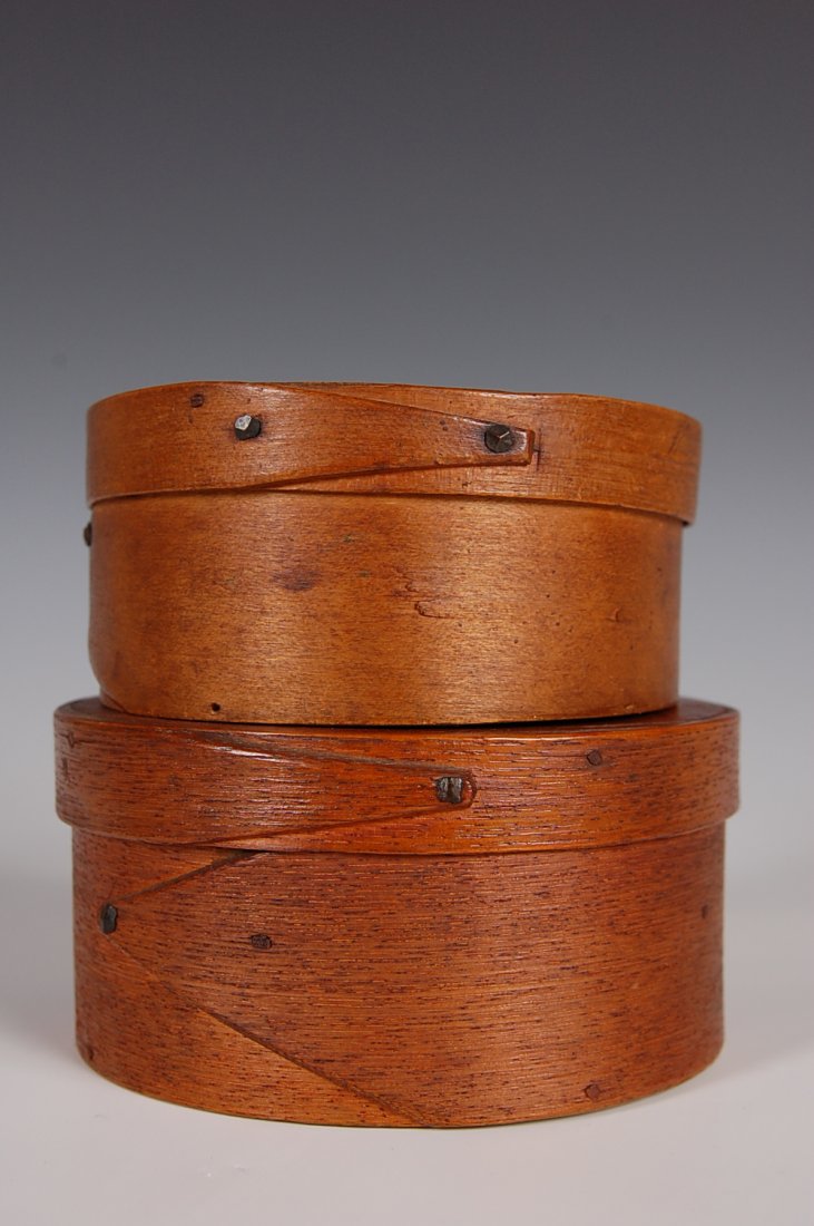 TWO 19TH C. PANTRY BOXES: Oak and pine woods, opposing fingers, wood pegged. New England. Measures 2.5 x 5.25 and 2 x 4.5 inches each.