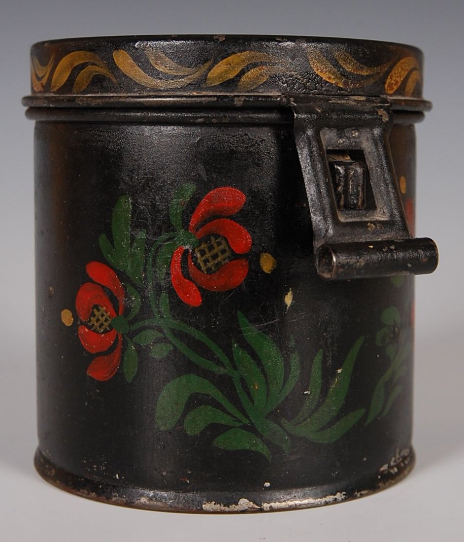 TOLE DECORATED LIDDED CANNISTER: Polychrome decoration in florals, hinged lid and latch, painted sides, top and rim. Measures 4.75 x 4.5 inches.