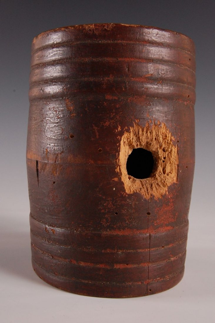 CIRCA 1800 PAINTED WOOD RUMLETT: Great old red paint, nice patina, two piece construction, worm wood with signs of age and use, paper provenance on both ends makes reference to an aonwer and a maker with attribution to Strafford, New
