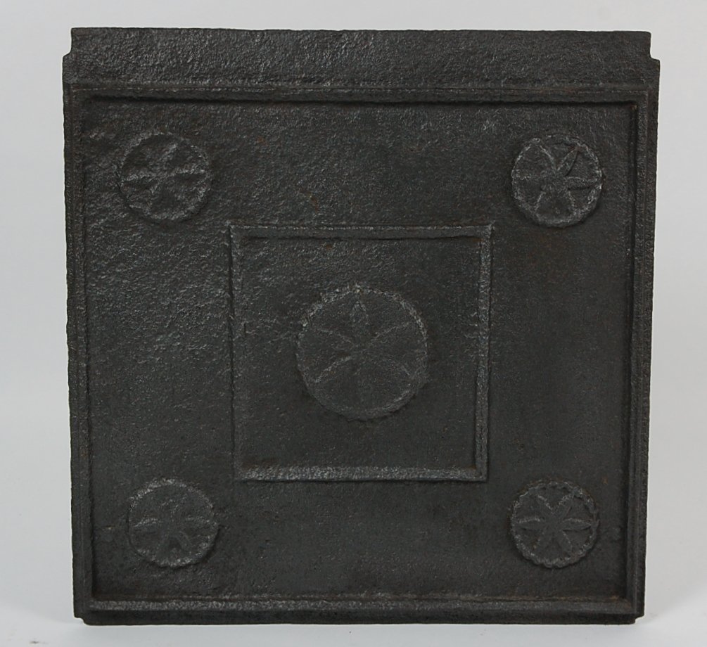 18TH C. VIRGINIA CAST IRON STOVE PLATE WITH ROSETTES: A circa late 1700's stove plate, one of five that, when heated by a large fire would retain and deliver increased radiant heat from the fire box that they formed. This is an important early example of