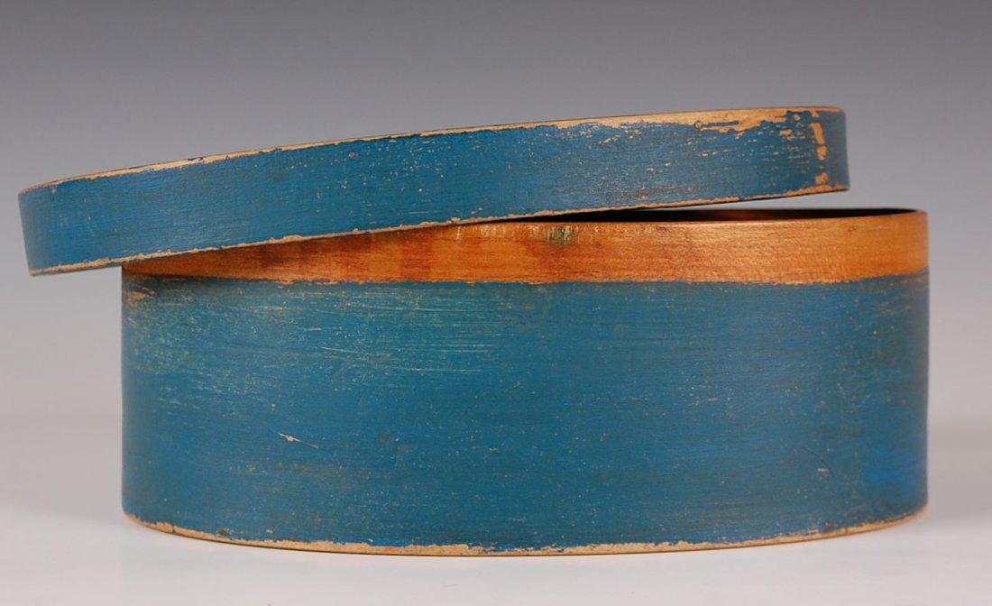 OVAL SHAKER STYLE PANTRY BOX: Copper tacked finger, wood pegged, maple and pine, blue surface. Measures 3.75 x 9.5 x 7 inches.