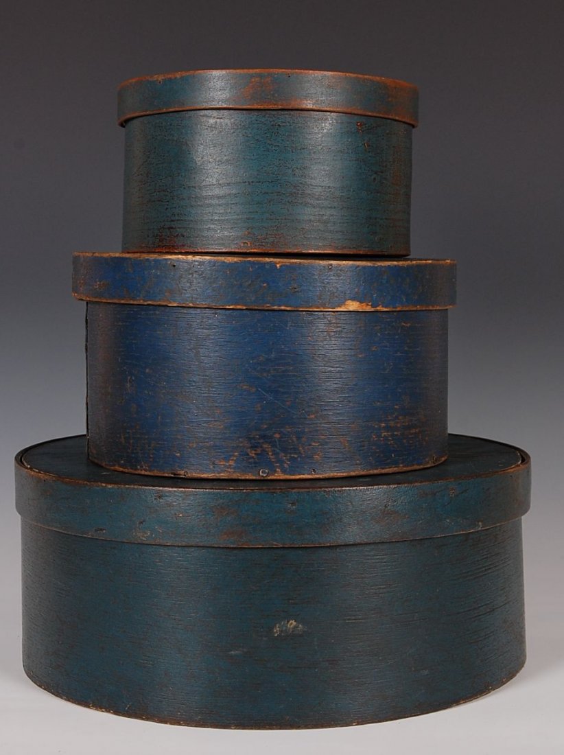 THREE GRADUATED 19TH C. PANTRY BOXES IN OLD BLUE PAINT: Oak-pine wood, deep blue surface, iron tack seams, wood pegged, minimal wear, smallest measures 4.25 h x 8 inches, largest 5.25 h x 13 inches. A good looking set in old paint with very similar constru