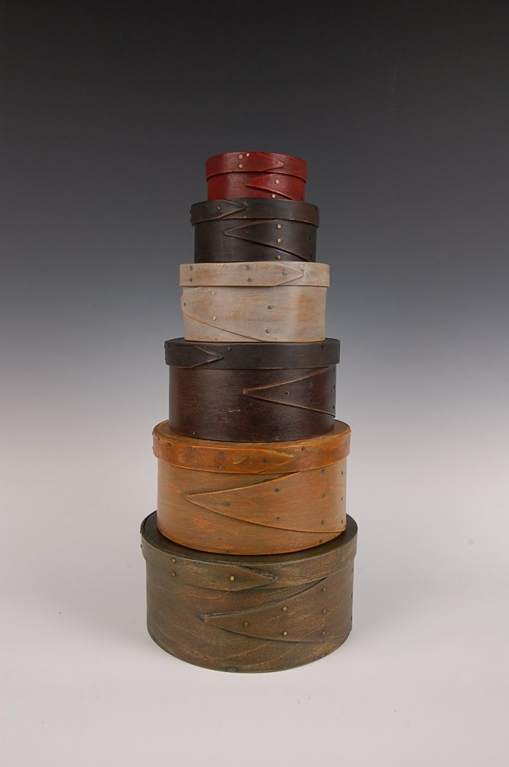 SIX 19TH CENTURY GRADUATED SIZE PANTRY BOXES: Graduated stack of six, various wood construction, natural surface, copper tacked, wood pegged, opposing fingers, stressed wear. Smallest measures 2.25 x 4.5 inches to 4 x 8.25 inches.