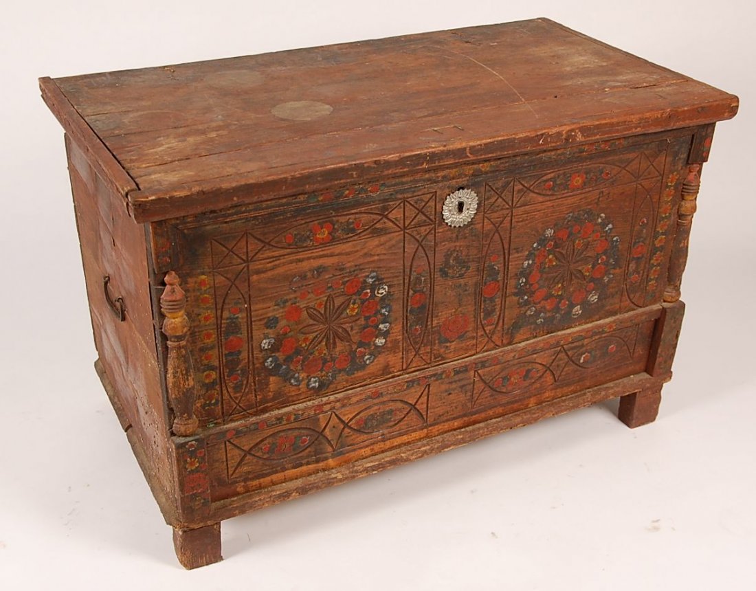 MARRIAGE CHEST: Dovetailed pine marriage chest with hinged lid and applied molding, divided front panel with faux lower long drawer. Geometric groove and floral carvings with painted floral wreaths and swags. Framed 