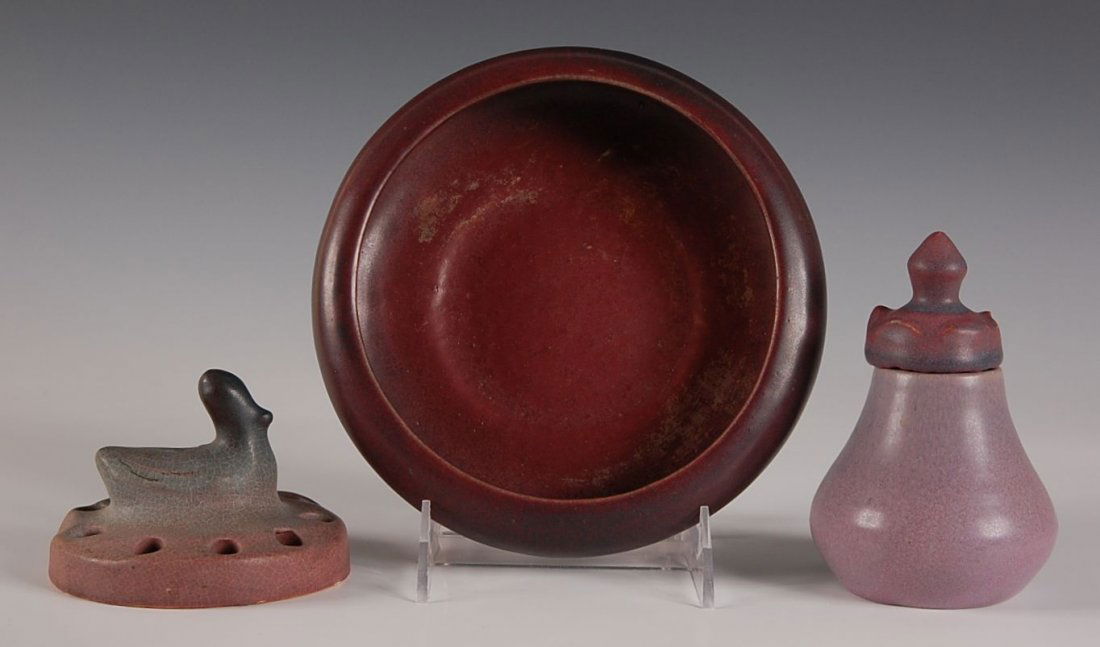 EARLY VAN BRIGGLE COVERED VASE W/ MULBERRY BOWL & FROG: Van Briggle console bowl with duck flower frog in matte mulberry glaze, both with hand scribed Van Briggle marks, 7 inch bowl with 3 x 4 inches frog. Plus an unmarked vase with a finial lid in mulberr