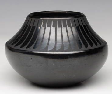 MARIA MARTINEZ (1887-1980) POLISHED JAR WITH FEATHERS: Maria Montoya Poveka Martinez (1887-1980) Jar with Stylized Feather Repeat Third quarter of the 20th century. The classic example of San Ildefonso Pueblo black-on-black pottery is signed Maria and Pop
