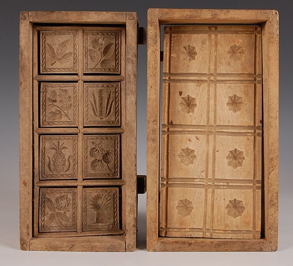 FINELY CARVED BUTTER PRINTER, PLUS ANOTHER: A two pound eight section butter printer with finely carved stamps of wheat, pineapple, berries, corn, acorn and florals, box joined ends with dowels, turned wood handle, measures 3.75 x 11 x 5.5 inch