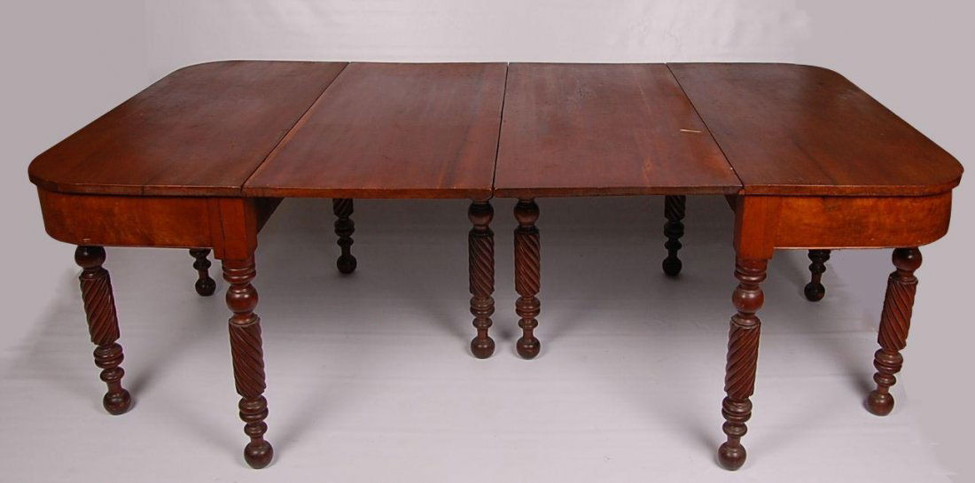 PAIR CIRCA 1850 SHERATON STYLE BANQUET TABLES: Cherry top and legs with flame cherry veneers on the skirt. T h measures 29.75 inches high by 45.5 inches wide and nearly 21 inches deep, with each drop leaf raised each half can measure 41 inches for