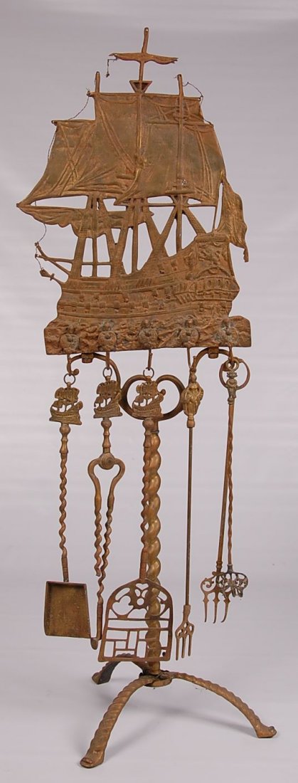 INTERESTING AND UNUSUAL BRASS FIREPLACE TOOL STAND: Circa 1920s figural brass galleon on stand with hangers now used to hold a fireplace tool set. The measurements are 50 1/2 inches high and 15 inches wide.