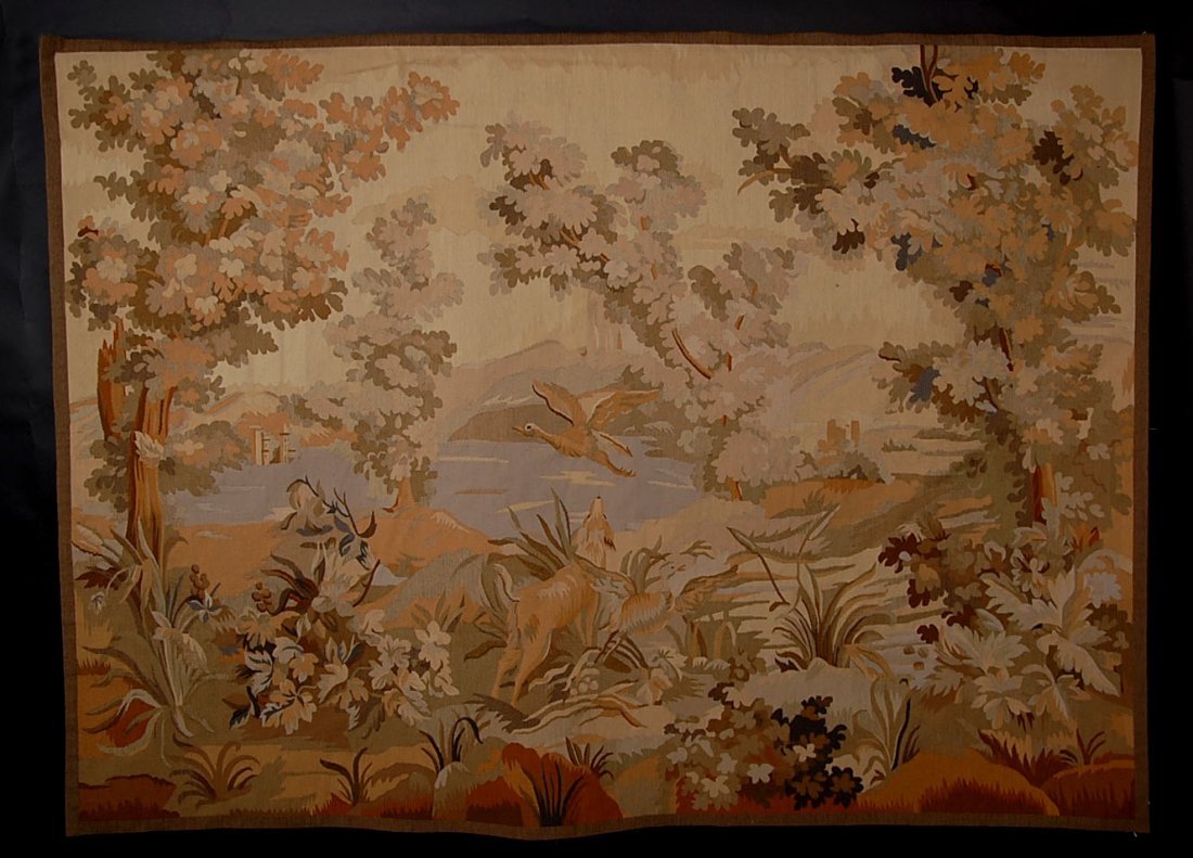 HANDMADE AUBUSSON TAPESTRY CIRCA 1900: A landscape with hunting dog and waterfowl at water's edge. Measures 49 x 81 inches.
