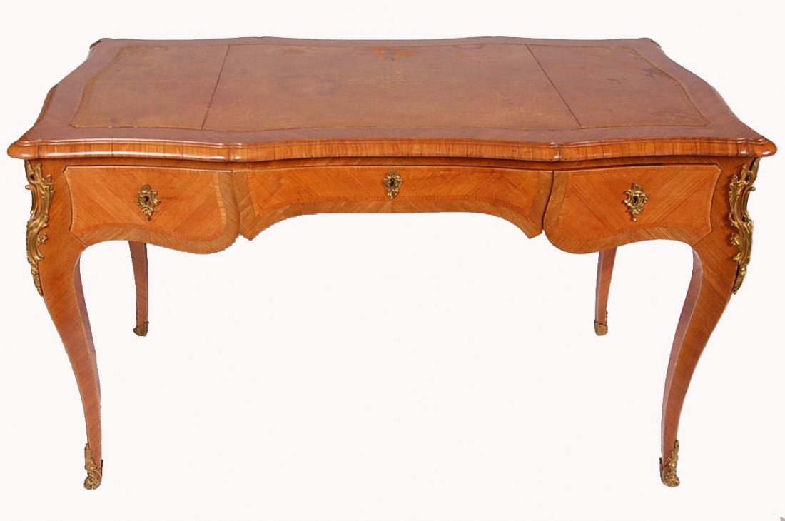 BRONZE MOUNTED FRENCH BUREAU PLAT: Circa early 20th century, inset leather top, bombe' sides and ends, three drawers and three false drawer fronts, measures 30 x 50 x 26 inches.