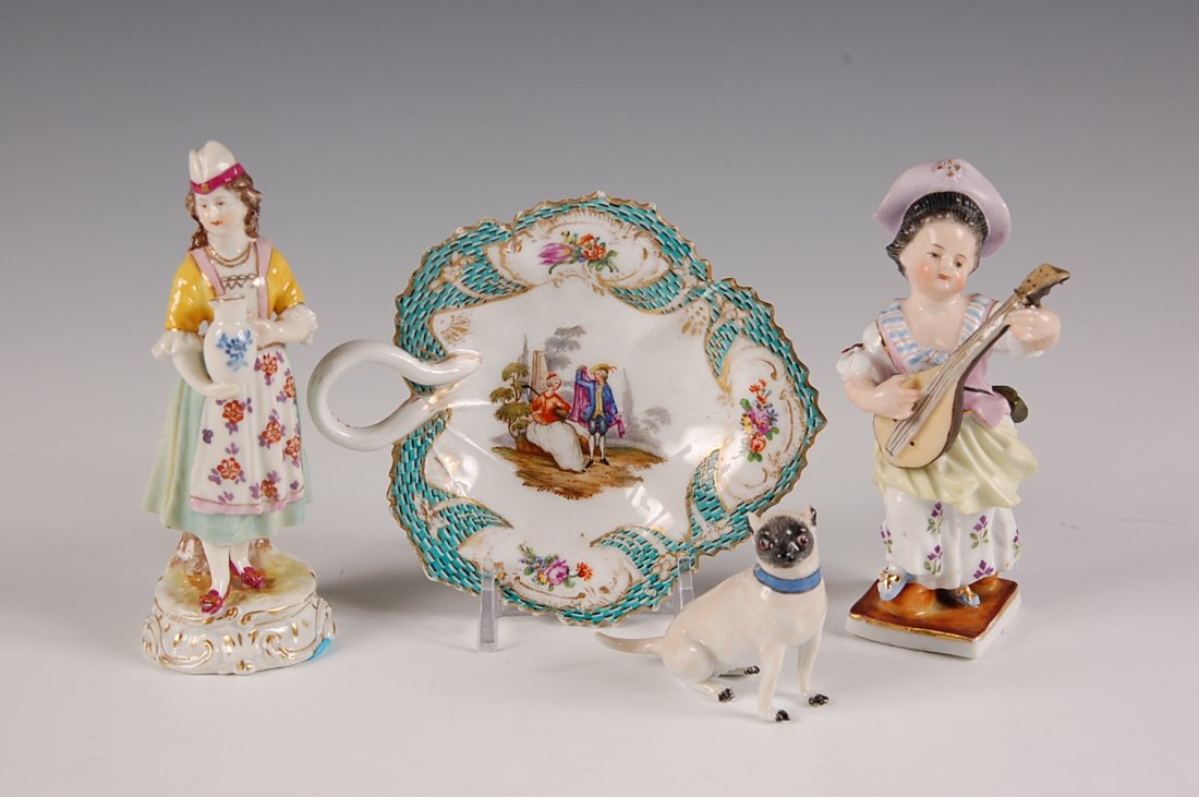 FOUR SMALL PIECES OF CONTINENTAL PORCELAIN: Including a 2 inch figure of a dog with blue crossed swords underglaze, and leaf shaped dish with blue crossed swords signature having a scratch through the mark, plus two 4 inch porcelain figures wit