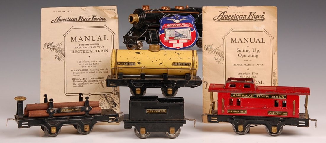 AMERICAN FLYER ENGINE, CARS, TRANSFORMER: 1930s era engine, with tender and three cars, in old box, with 1047 transformer, two manuals. All pieces show wear and age, unknown working condition, average.
