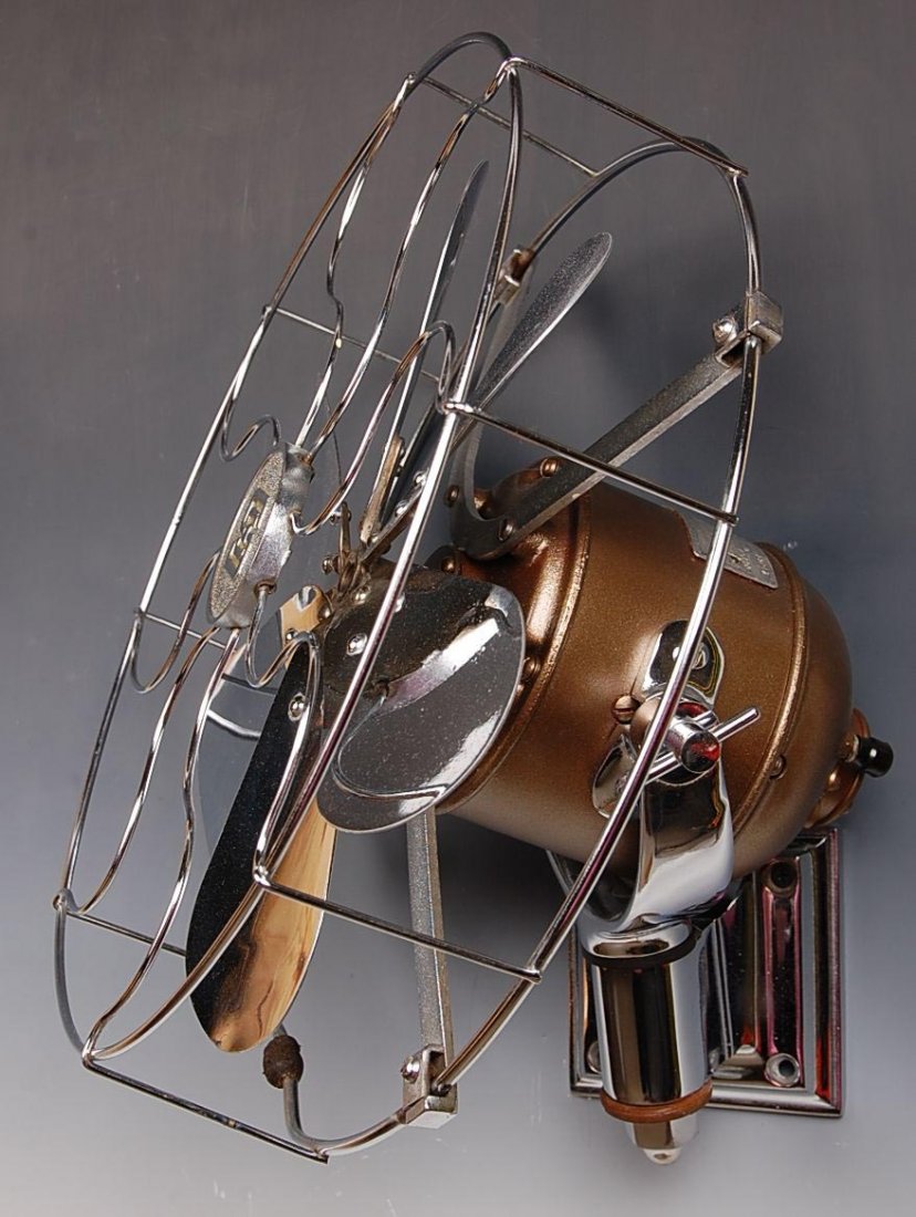 SHINY CHROME SAFETY CAR CO WALL MOUNT RR CAR FAN: Original near mint chrome, applied tag reads 'The Safety Car Heating & Lighting Co., NY, Motor 28588, Fan No. L9912, serial 41609.' Measures 13.25 inches in diameter, 9 inches deep.