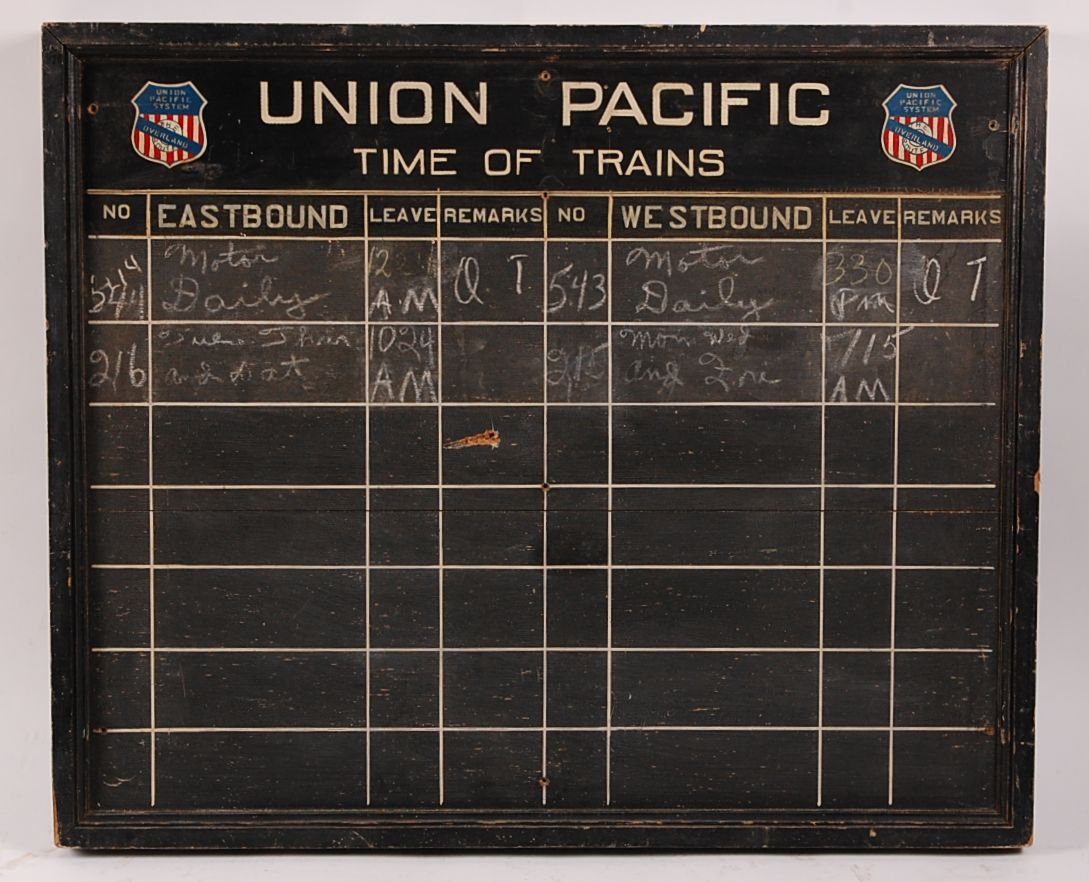 UNION PACIFIC RAILROAD TIME OF TRAINS CHALK BOARD: UP Overland Route. Wood board with painted logos and columns. Measures 30.25 x 36 inches. Shows normal wear and age, genuine use.