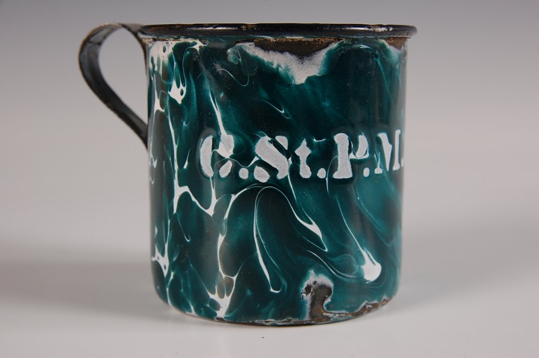 C.St.P.M.&O. RAILROAD ENAMELWARE CUP: Enamelware cup with Chicago, St. Paul, Minneapolis and Ohio logo. Measures 2.75 x 3.5 inches. Some enamel wear and loss, oxidation to exposed metal.