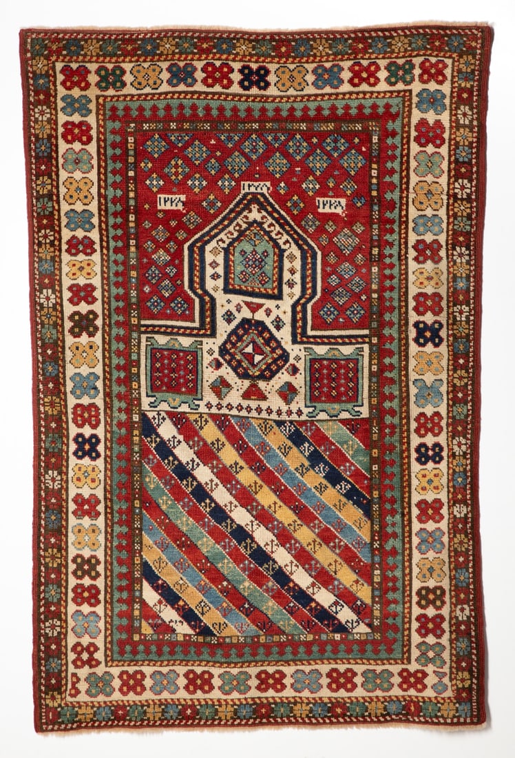 A RARE GENDJE PRAYER RUG DATED AH 1278/1861 AD (1 of 17)