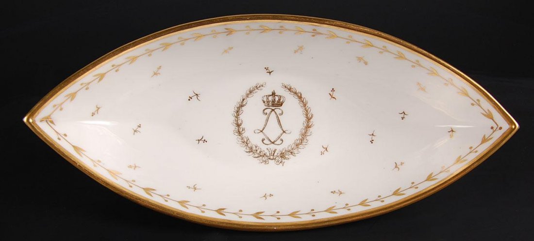 19TH C. SEVRES CELERY FROM CHARLES X SERVICE: Porcelain navette shape celery with monogram and overglaze marking under the base. Marked on the base with accession numbers from a collection. Measures approximately 10 inches long.