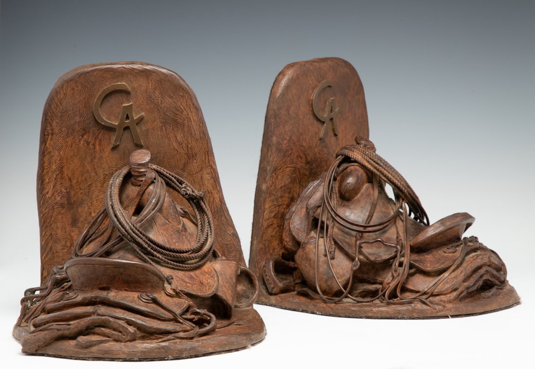 BILL NEBEKER (B. 1948) ARTIST CAST BRONZE: Bill Nebeker (Born 1948) Cowboy Artists of America Saddle Bookends 1999 Each handsome example is cast with the Cowboy Artists of America. CA monogram and designated as an Artist's Cast number 1 of onl