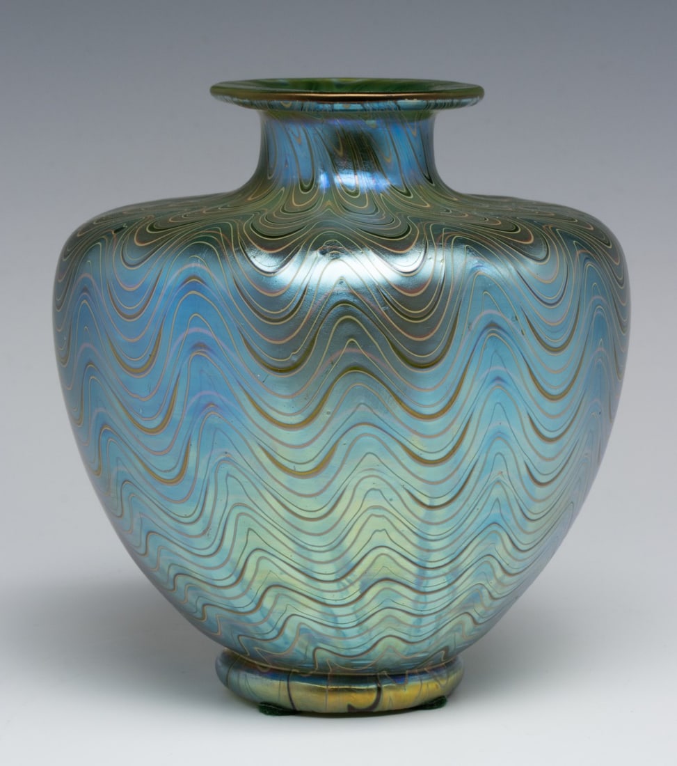 AN ART NOUVEAU VASE WITH PHAENOMEN TECHNIQUE ATTR LOETZ: Circa 1900. An Art Nouveau iridescent glass vase with combed iridescent decoration in the Phaenomen technique, unsigned. Measures 5.25 x 5 x 5 inches. Without proof of exemption, be aware that interne