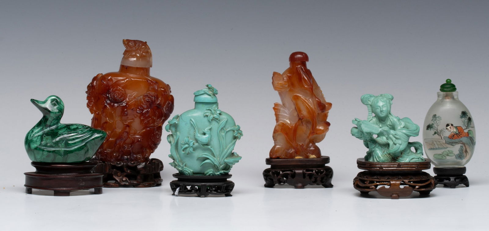 CHINESE TURQUOISE, HARDSTONE AND GLASS SNUFF BOTTLES: The grouping carnelian, turquoise and reverse on glass snuff bottles is offered with a malachite figure. Measures from 0.5 to 4 inches tall. Without proof of exemption, be aware that internet sales ta