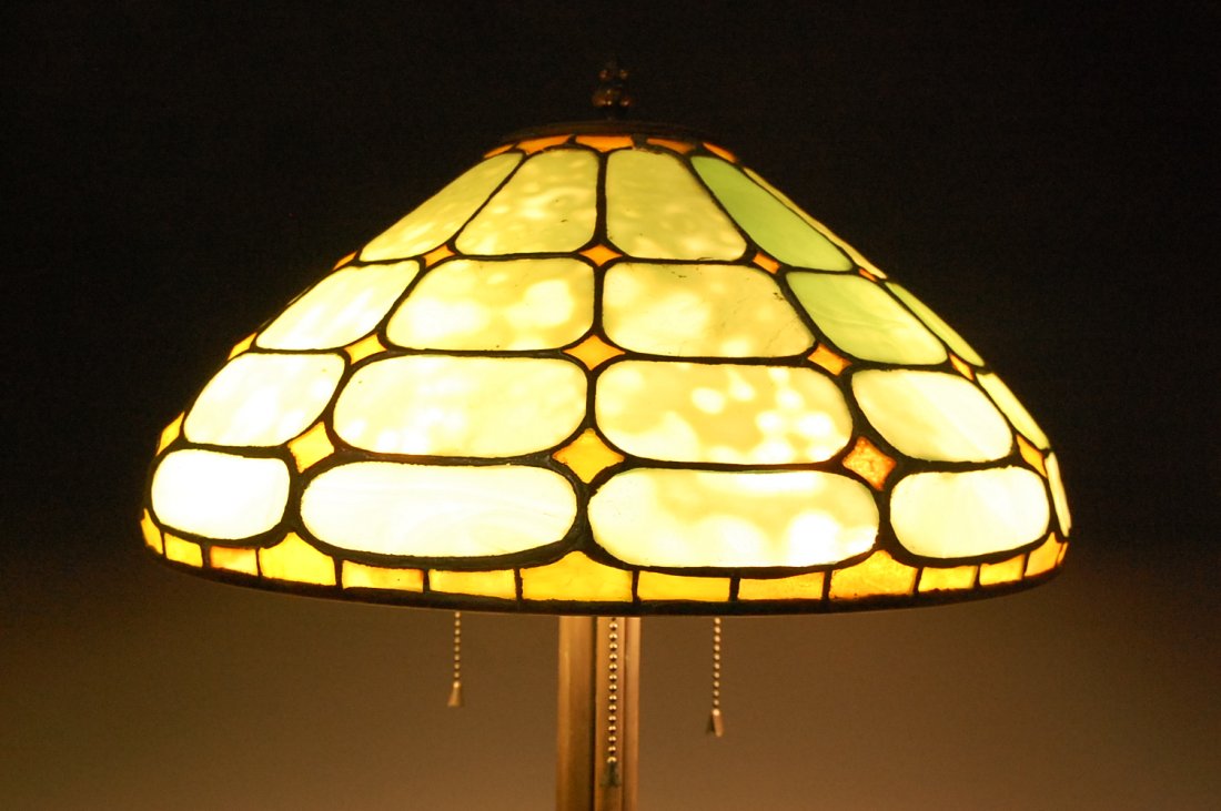 TIFFANY STUDIOS 'COLONIAL' PATTERN LEADED LAMP SHADE: An original leaded shade in the 'Colonial' pattern signed Tiffany Studios and numbered 1594.Shade only measures 7h x 16 inches diameter with a 3.5 inch diameter top opening. The base is a modern bronz