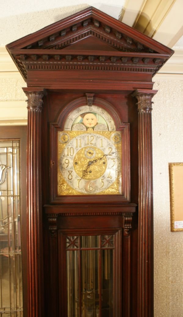 HERSCHEDE MODEL 122 MASSIVE 9 TUBE MAHOGANY HALL CLOCK: Mahogany Grandfather Clock with silvered and gilt engraved dial with central hand engraved symbol of a crown attributed to Herschede, hand painted moon phase. Westminster chimes, nine tubes, stately G