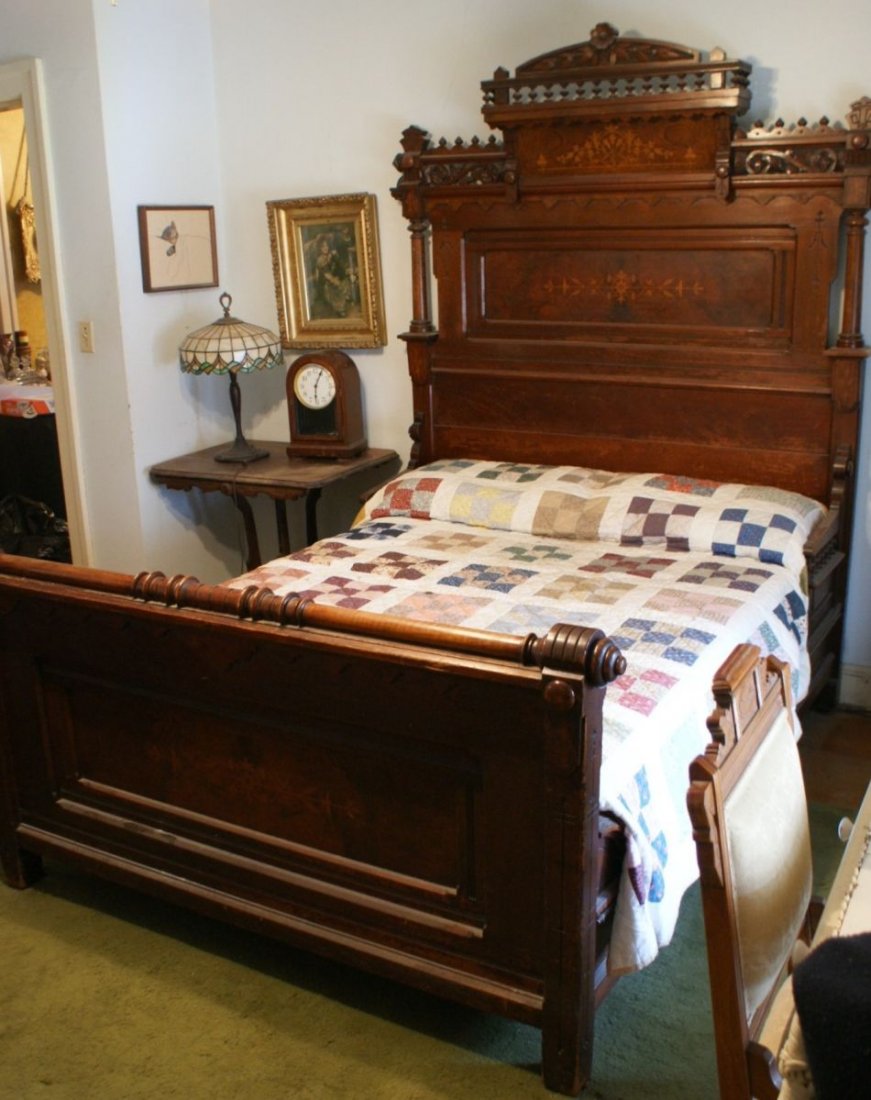 TWO PIECE VICTORIAN WALNUT BEDROOM SET WITH INLAYS: High back Victorian bed with burled panels and inlaid designs, matching dresser if unusal form and matching inlays.