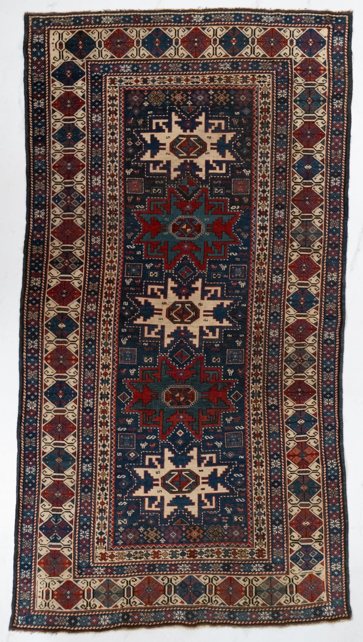 A FINE LESGHI RUG, EAST CAUCASUS, CIRCA 1890 (1 of 13)